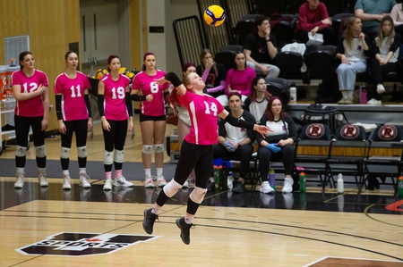 Emily Wezeman hits a serve in UNB's win over the Dalhousie Tigers on Friday night (Photos by: James West/ for UNB Athletics).