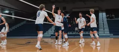SPARTANS HOLD OFF MOUNT ROYAL TO EARN FOUR-SET WIN