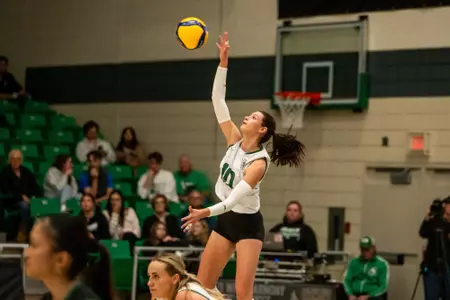 Huskies Show Fight, But Fall in Four Sets to Pandas