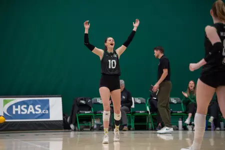 Huskies Clinch First Round Bye With Road Win Over
Cougars